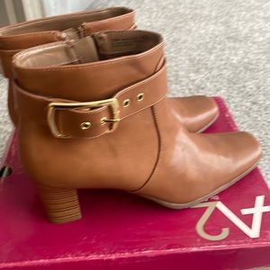 Buckled boot with heel